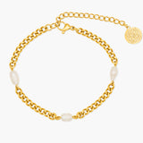 Gold chain bracelet with pearls on a white background