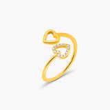 Gold ring with a heart design on a white background