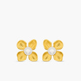 Gold flower-shaped earrings with pearl centers on a white background