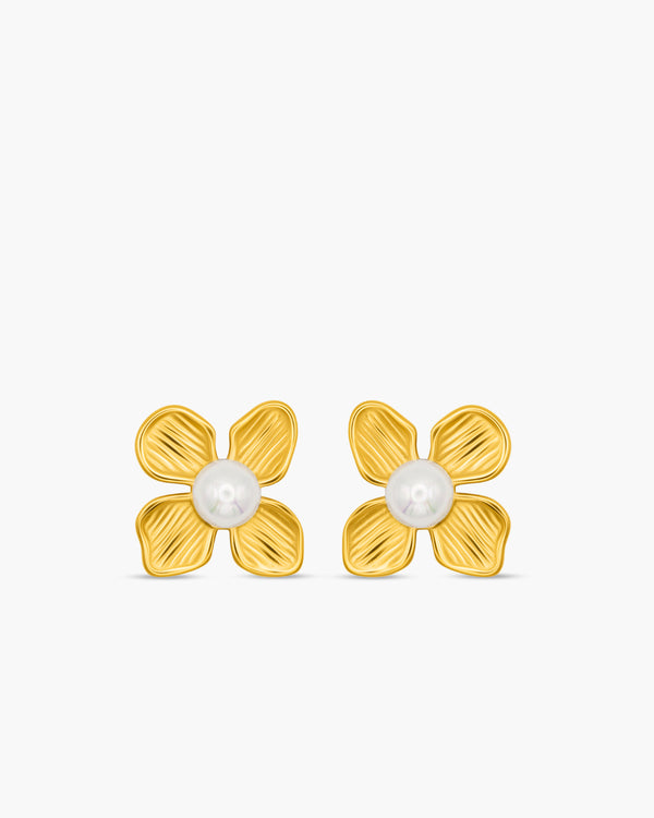 Gold flower-shaped earrings with pearl centers on a white background