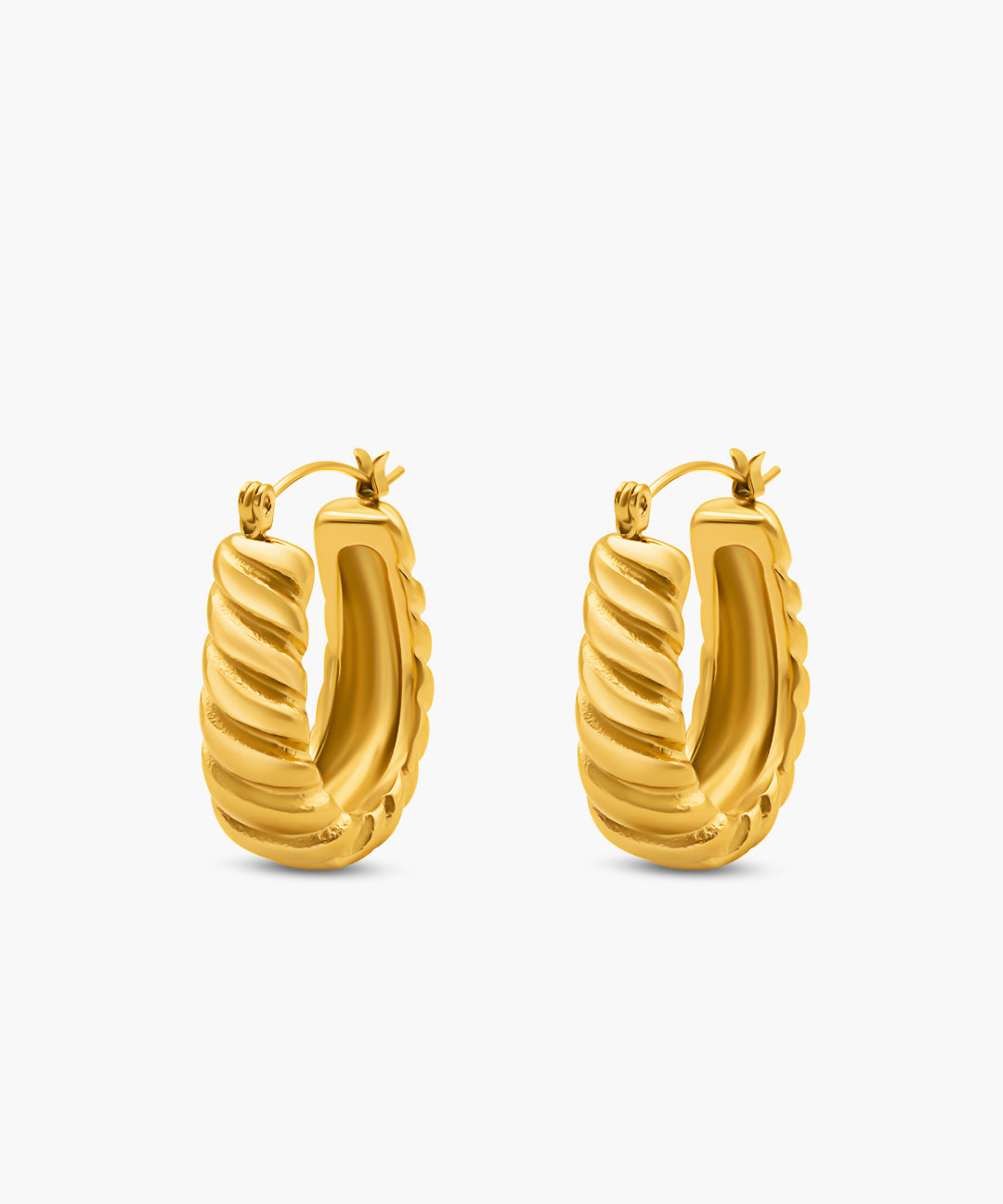 Gold hoop earrings on a white background