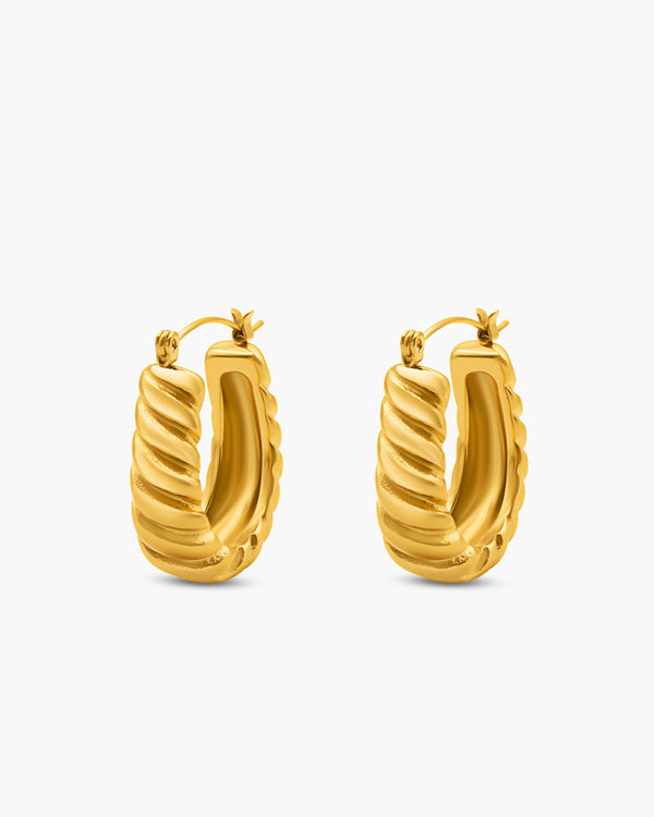 Gold hoop earrings on a white background