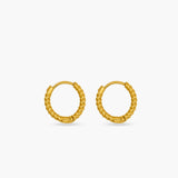 Gold hoop earrings on a white background
