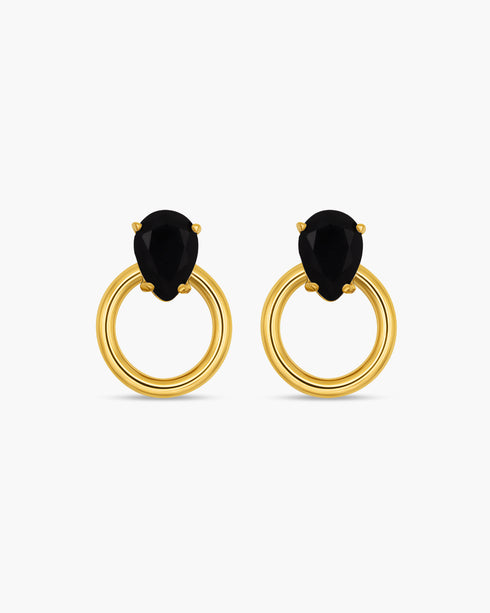 Gold hoop earrings with black gemstones on a white background