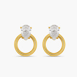 Gold hoop earrings with clear gemstones on a white background