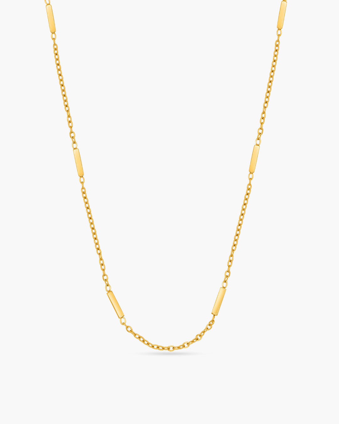 Gold chain necklace on a white background
