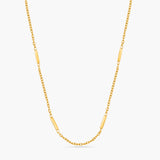 Gold chain necklace on a white background