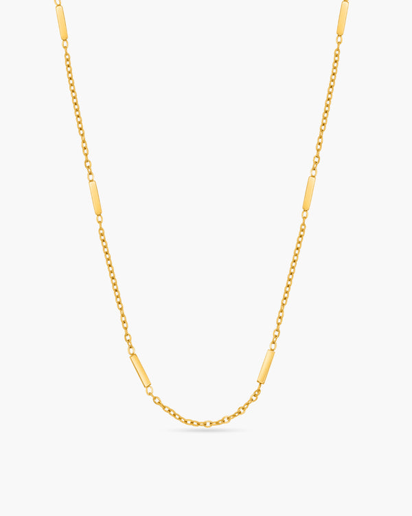 Gold chain necklace on a white background