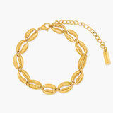 Gold bracelet with shell-like links on a white background