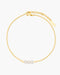 Gold anklet with three pearls on a white background