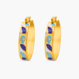 Gold hoop earrings with blue and white pattern on a white background