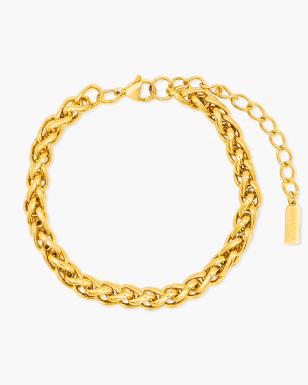 Gold chain bracelet on a white background