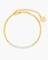 Gold anklet with pearl accents on a white background