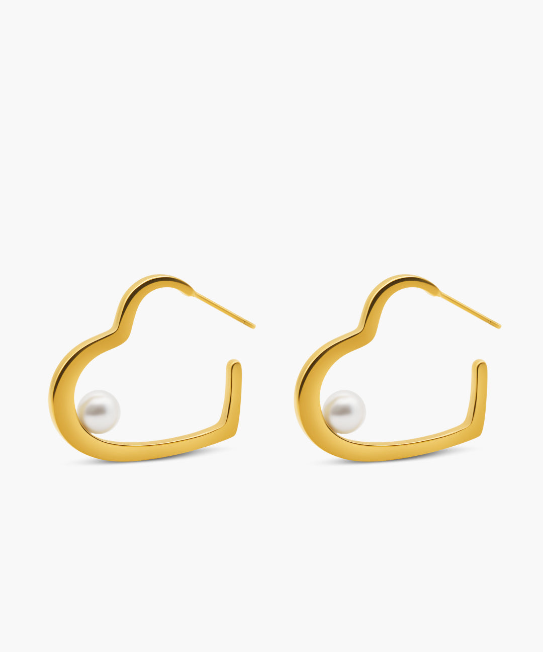 Gold hoop earrings with pearl centers on a white background