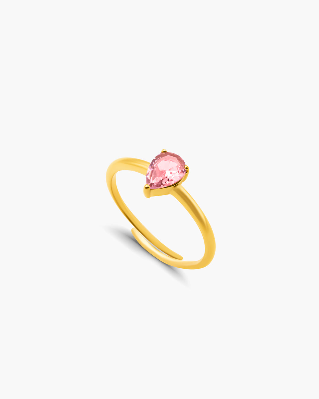 Gold ring with a pink gemstone on a white background
