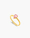 Gold ring with a pink gemstone on a white background