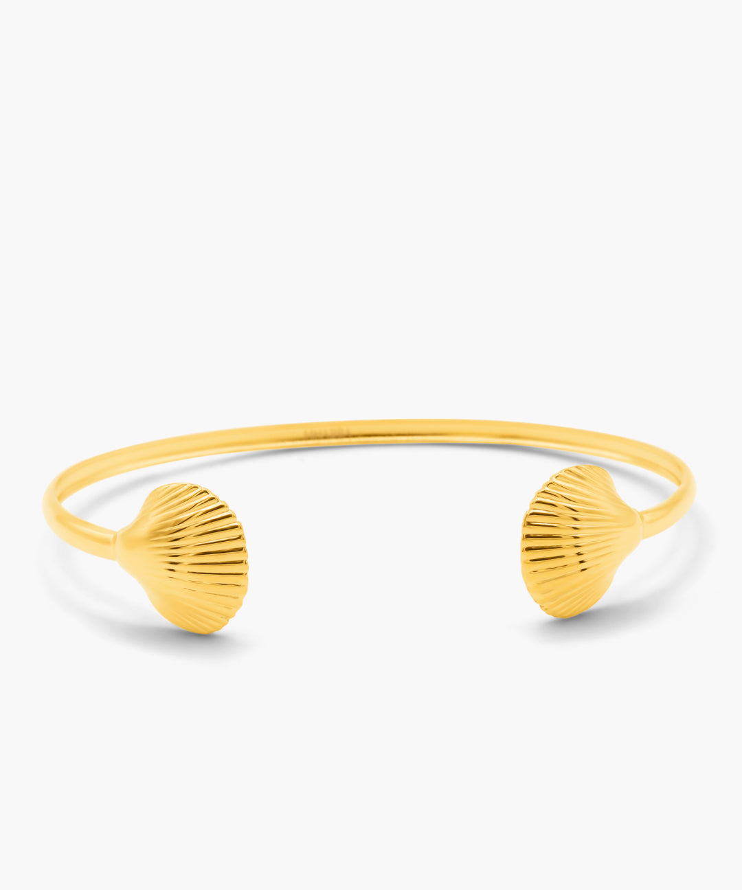 Yellow shell-shaped bangle on a white background