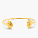 Yellow shell-shaped bangle on a white background