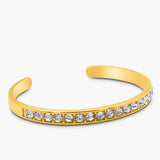 Gold bracelet with crystal stones on a white background