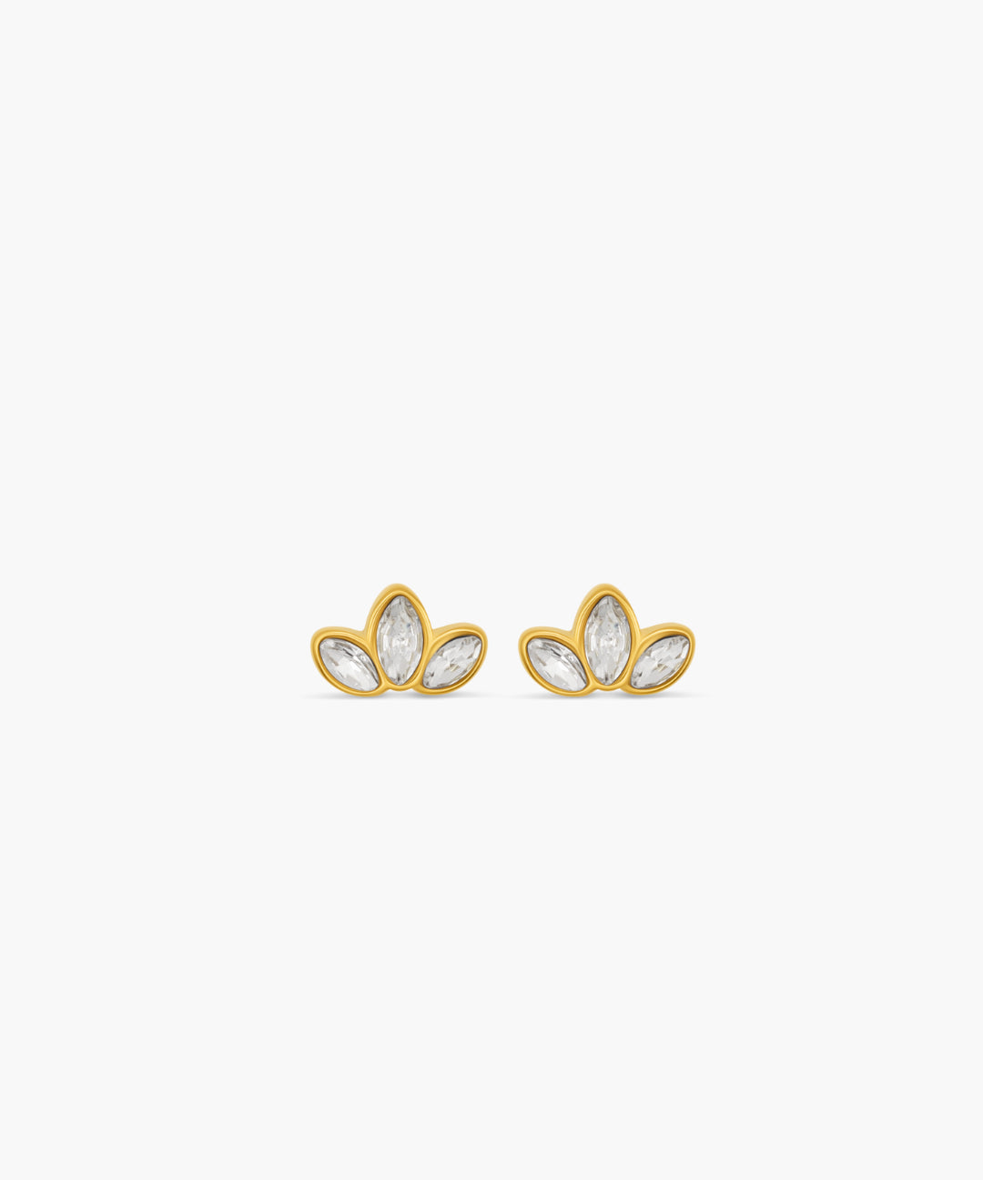 Gold earrings with clear stones on a white background