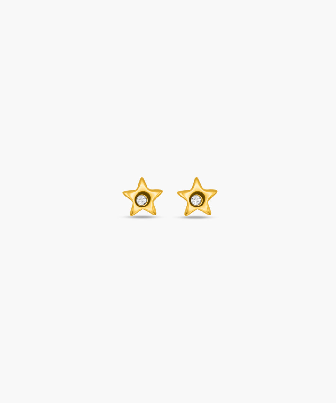 Gold star-shaped earrings on a white background