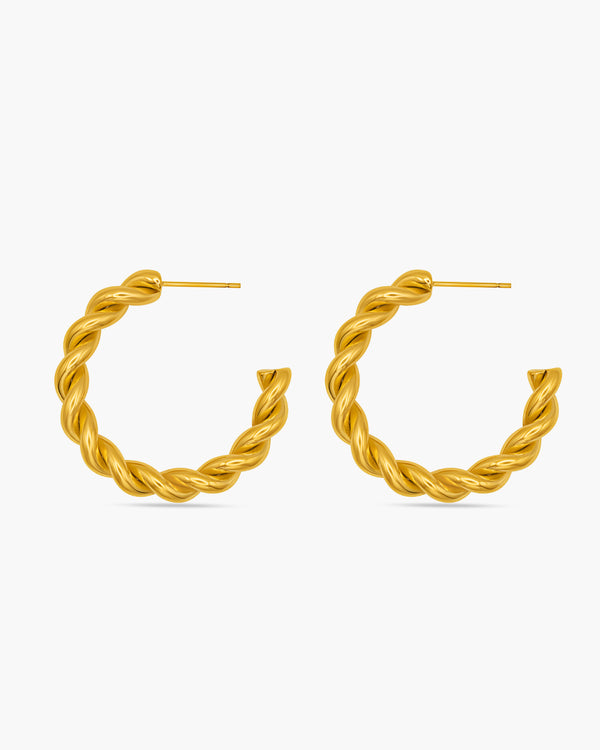 Pair of gold hoop earrings on a white background