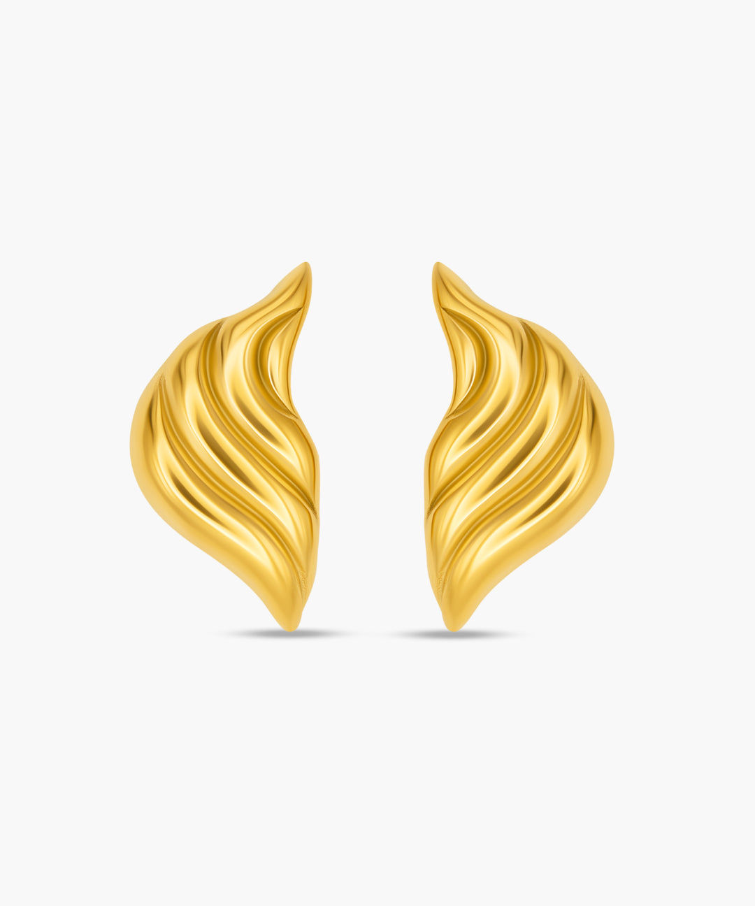 Pair of gold earrings on a white background