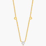 Gold necklace with a diamond pendant on a white background