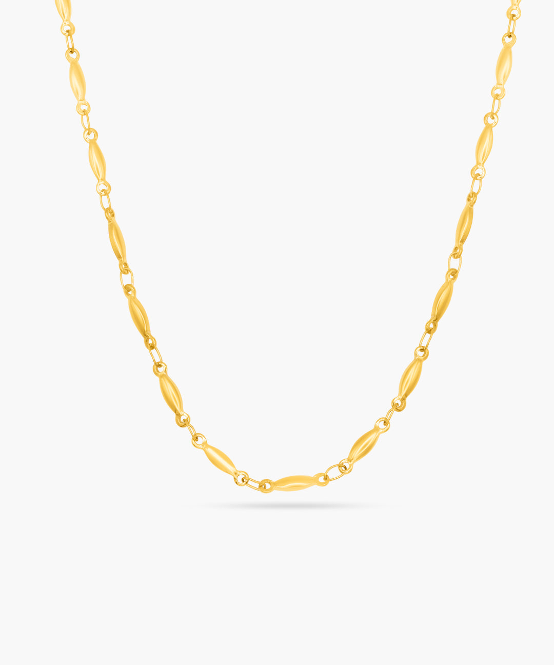 Gold chain necklace on a white background