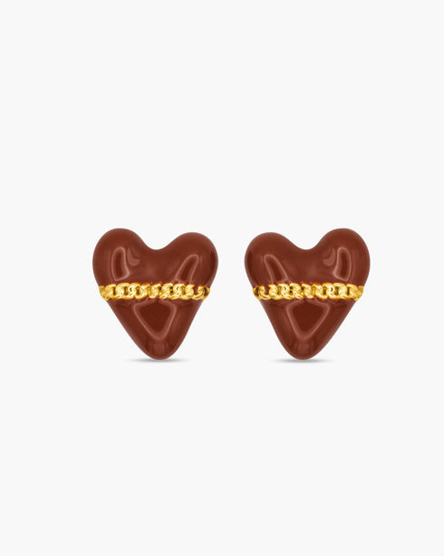 Heart-shaped earrings with gold chains on a white background