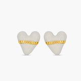 Heart-shaped earrings with gold chains on a white background