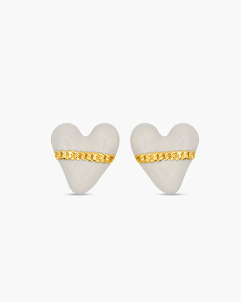 Heart-shaped earrings with gold chains on a white background
