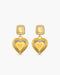 Gold heart-shaped earrings on a white background