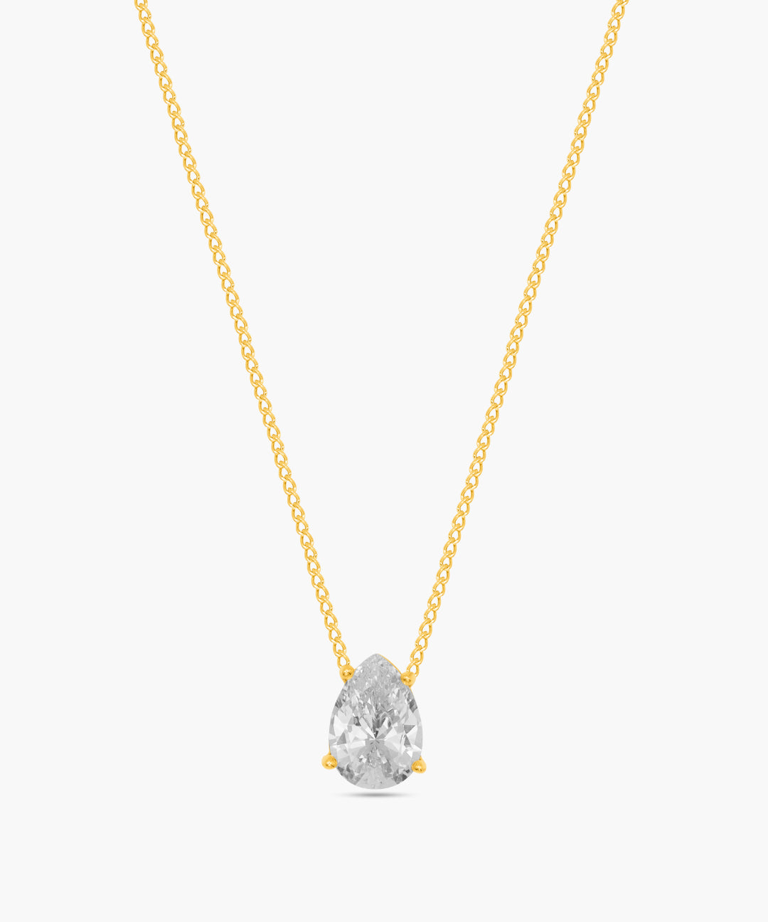 Gold necklace with a clear teardrop-shaped pendant on a white background
