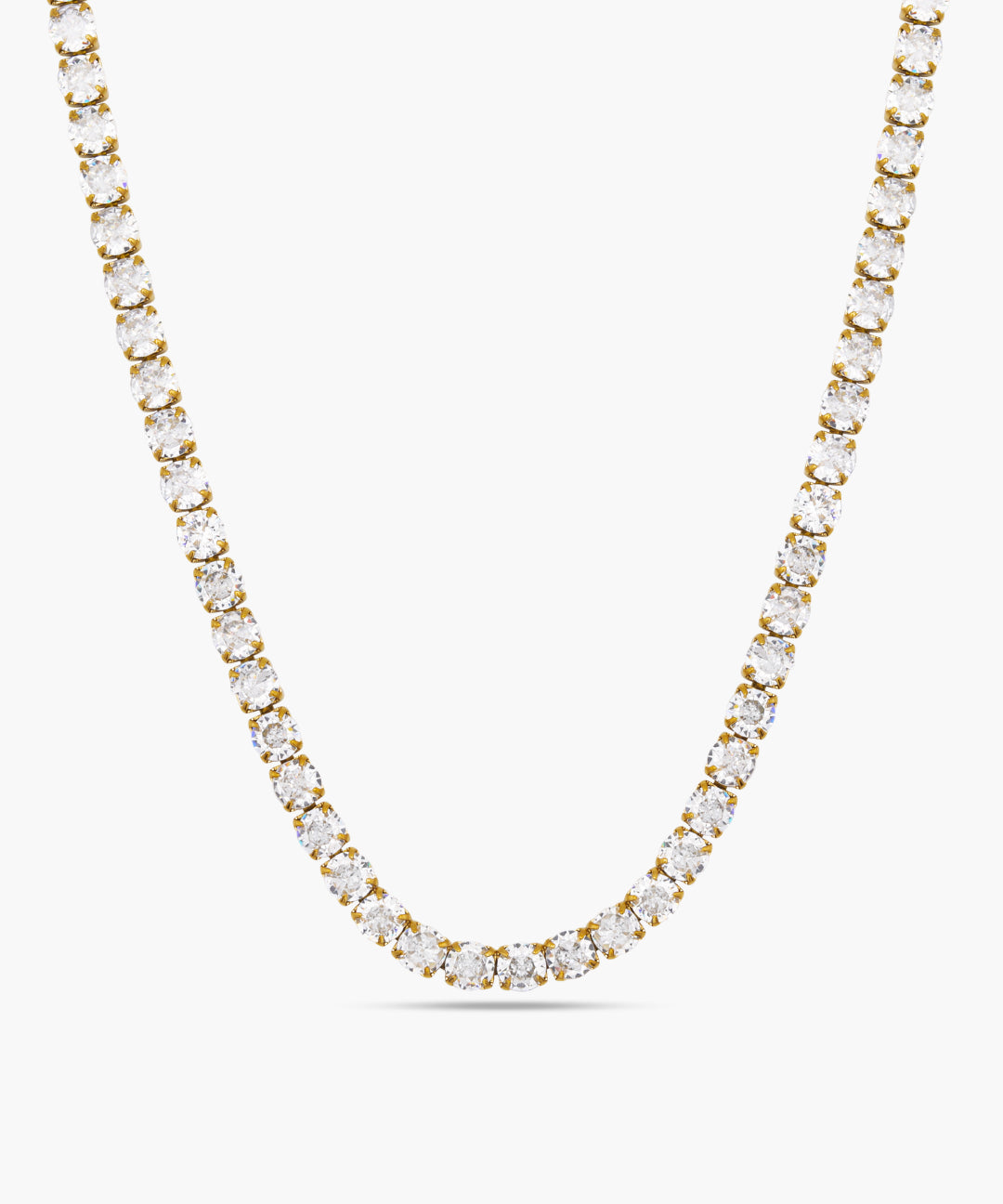 Gold necklace with clear stones on a white background