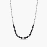 Necklace with black and gray beads on a white background