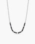 Necklace with black and gray beads on a white background