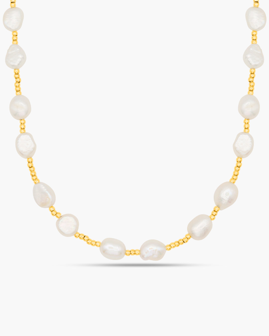 Pearl necklace with gold chain on a white background