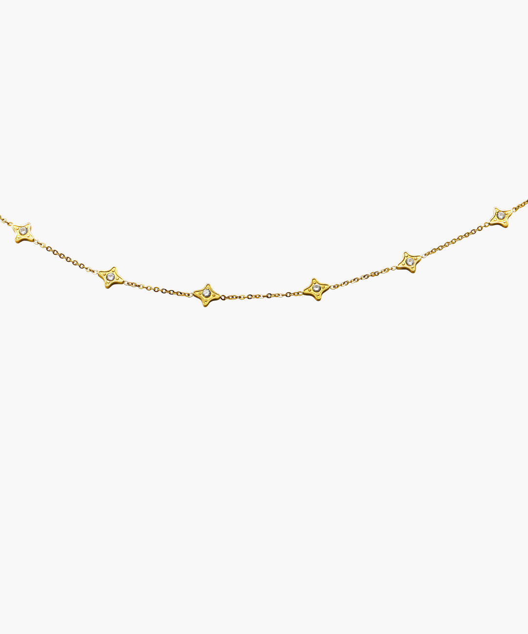 Gold necklace with star-shaped pendants on a white background