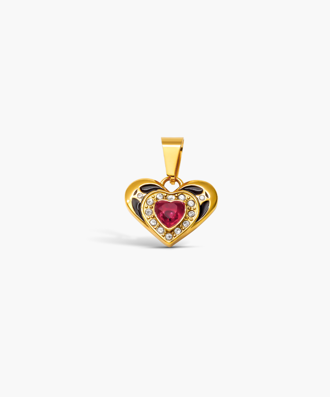 Heart-shaped gold pendant with a red gemstone on a white background